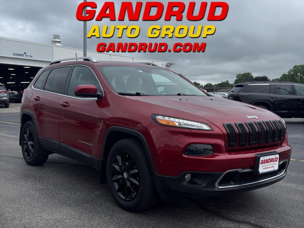 2016 Jeep Cherokee Limited in Deep Cherry Red C — front three-quarter view