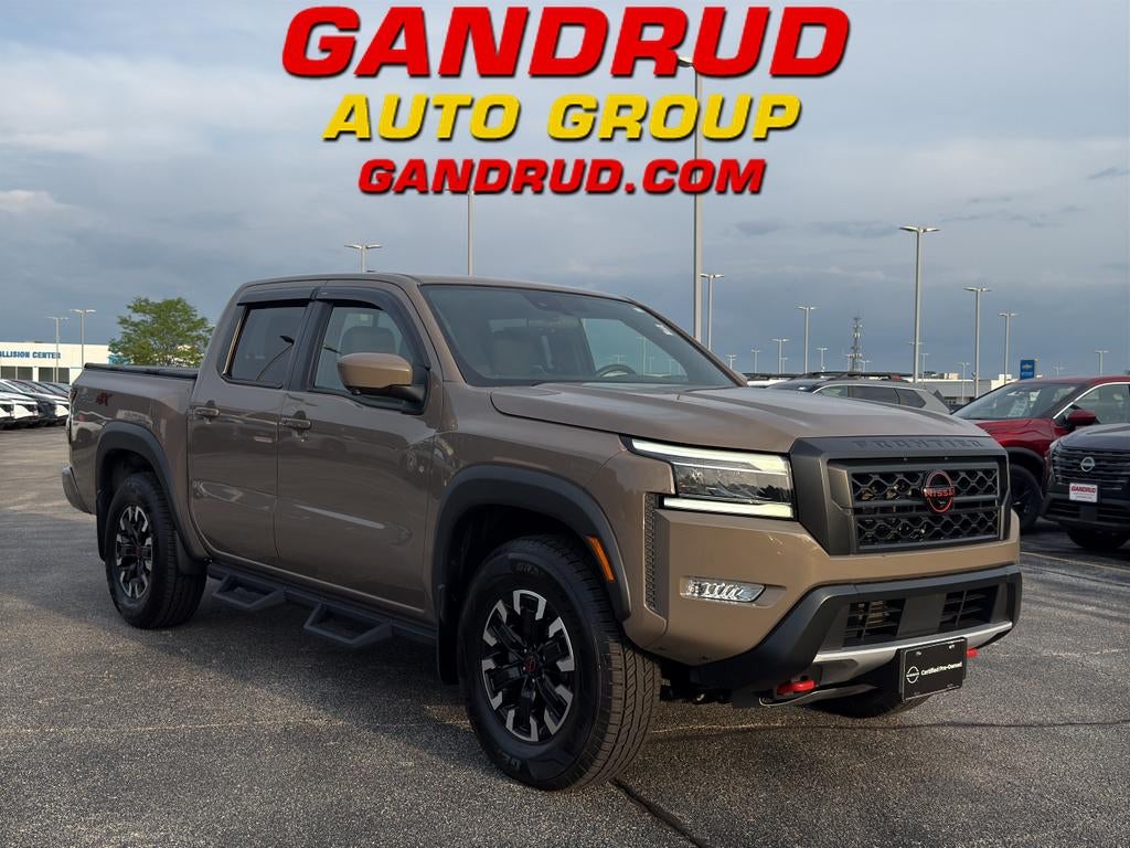 2023 Nissan Frontier Crew Cab PRO-4X 4x4 in Beige — front three-quarter view