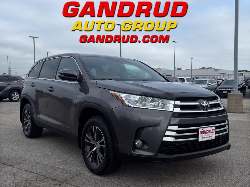 2019 Toyota Highlander LE Plus in Red — front three-quarter view
